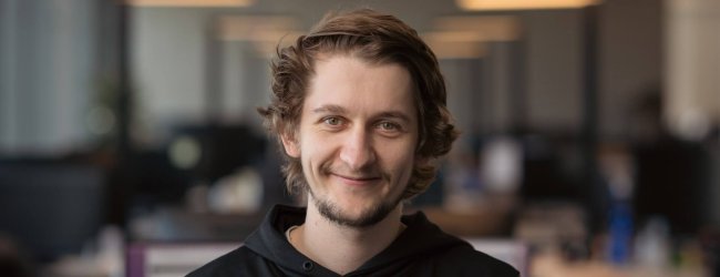 man smiling looking at camera in an office